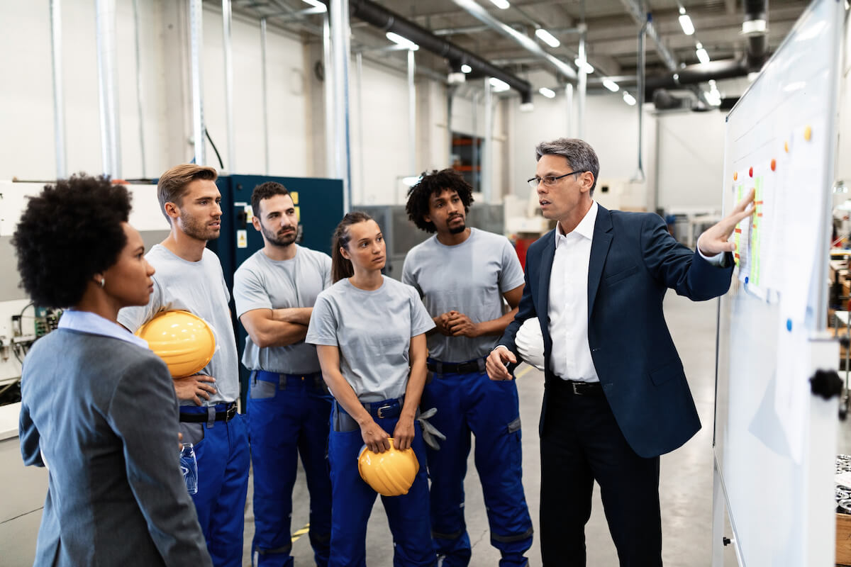 Engineer explaining a plan to his team