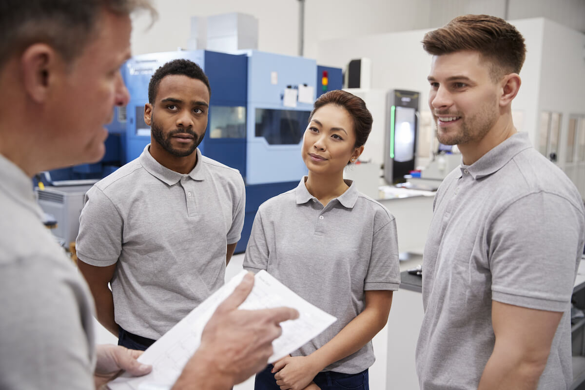 How to manufacture a product: engineers having a team meeting